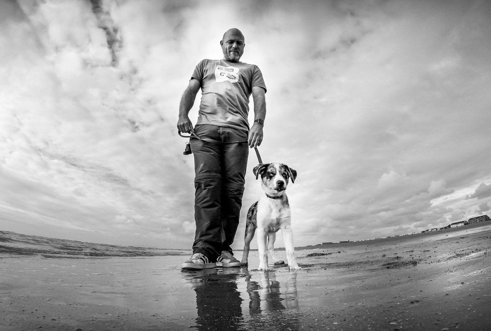 Paul steele and puppy malc on the beach