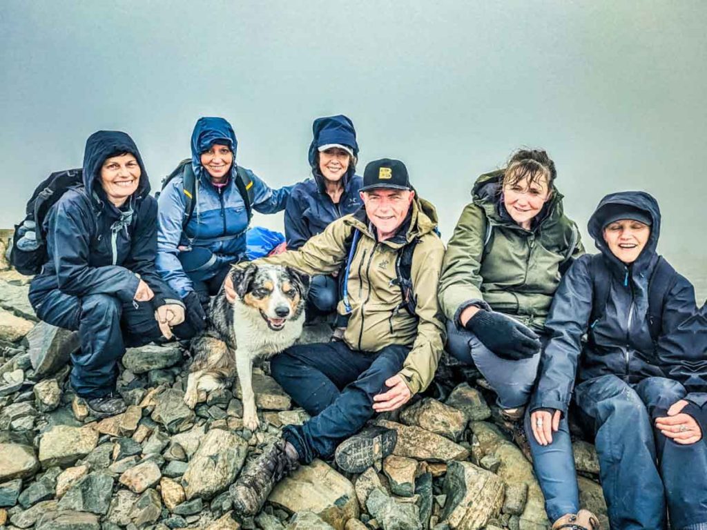 group of hikers in rain jackets
