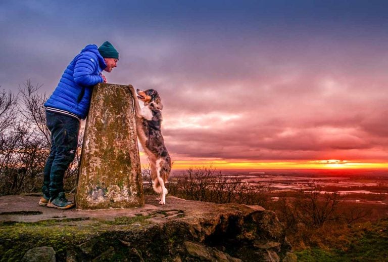 BaldHiker and dog at sunset on Bardon Hill
