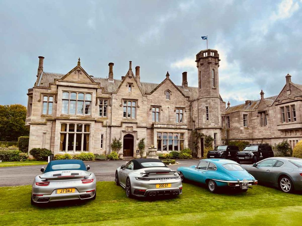 Posh cars lined up outside SCHLOSS Roxburghe