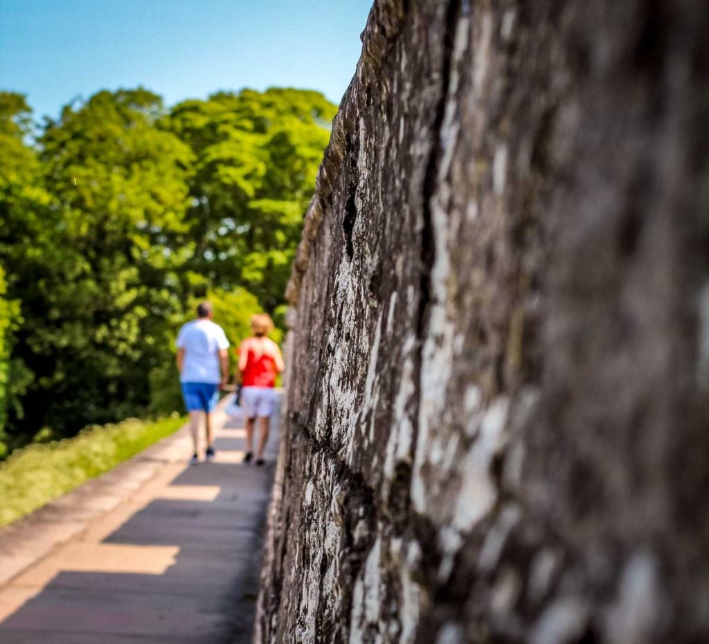 a view along york city walls with 2 walkers