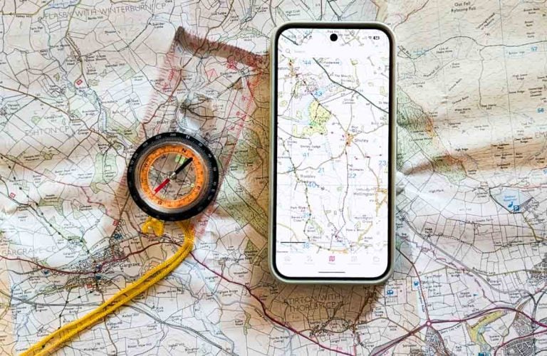 compass and smartphone with maps