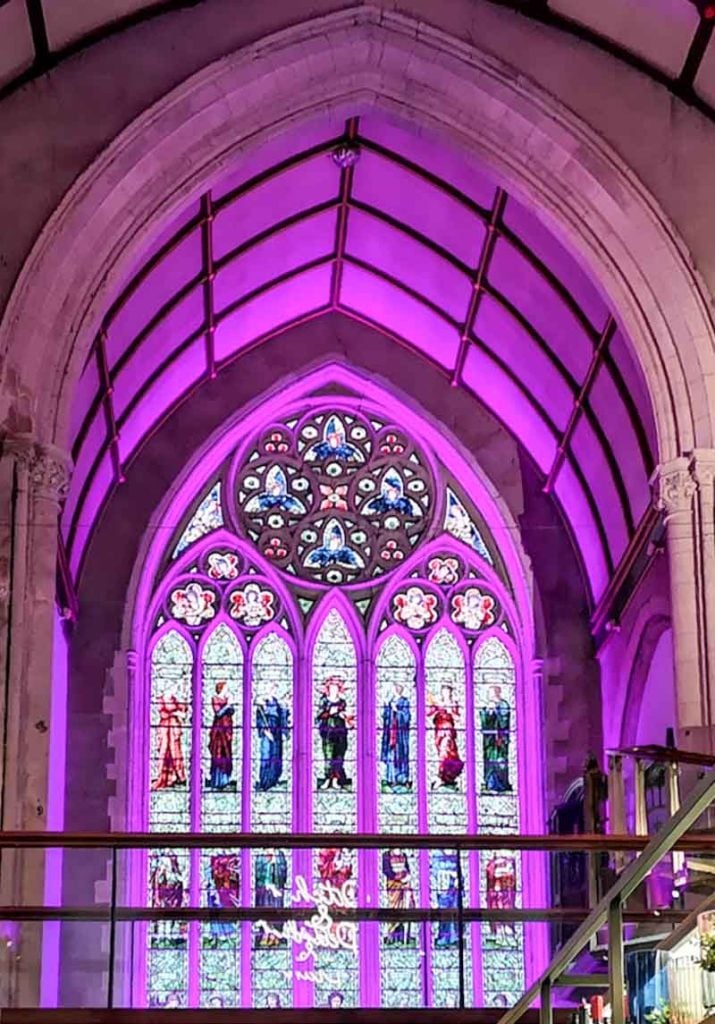 illuminated old church window at the Pitcher and Piano