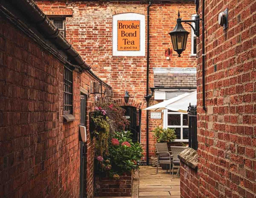looking down the alleyway into courtyard cafe