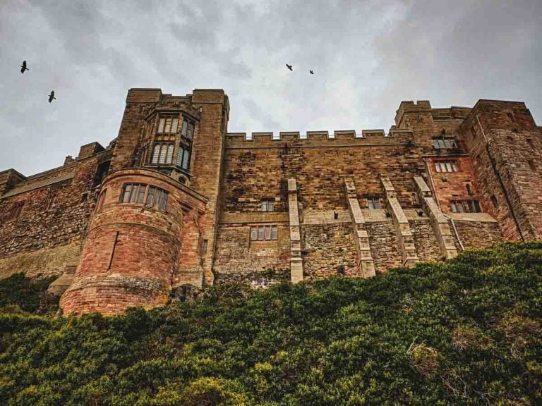looking up at Bamburgh Castle from below
