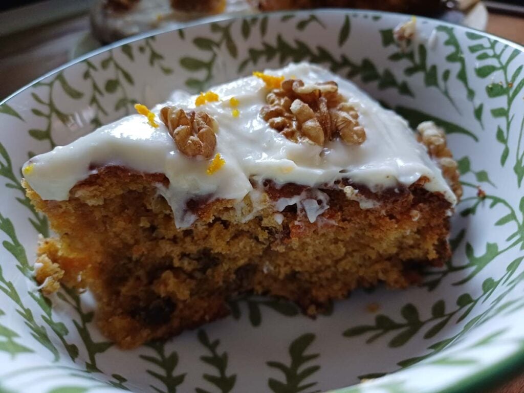slice of carrot cake in a bowl