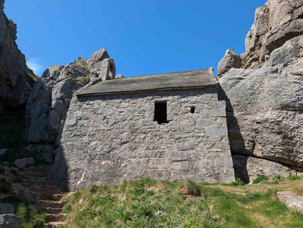 view of St Govan's chapel from below
