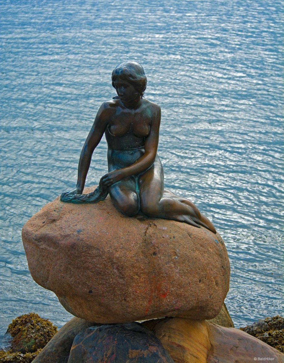 the little mermaid on the rock in the harbour