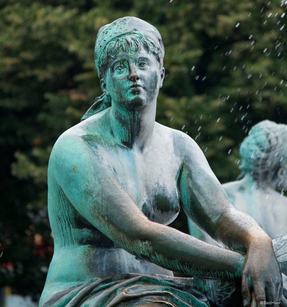 The Neptune Fountain of Berlin woman figure on Neptune fountain