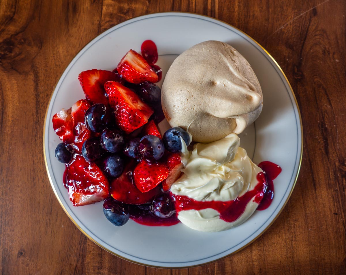 served summer fruits and meringue
