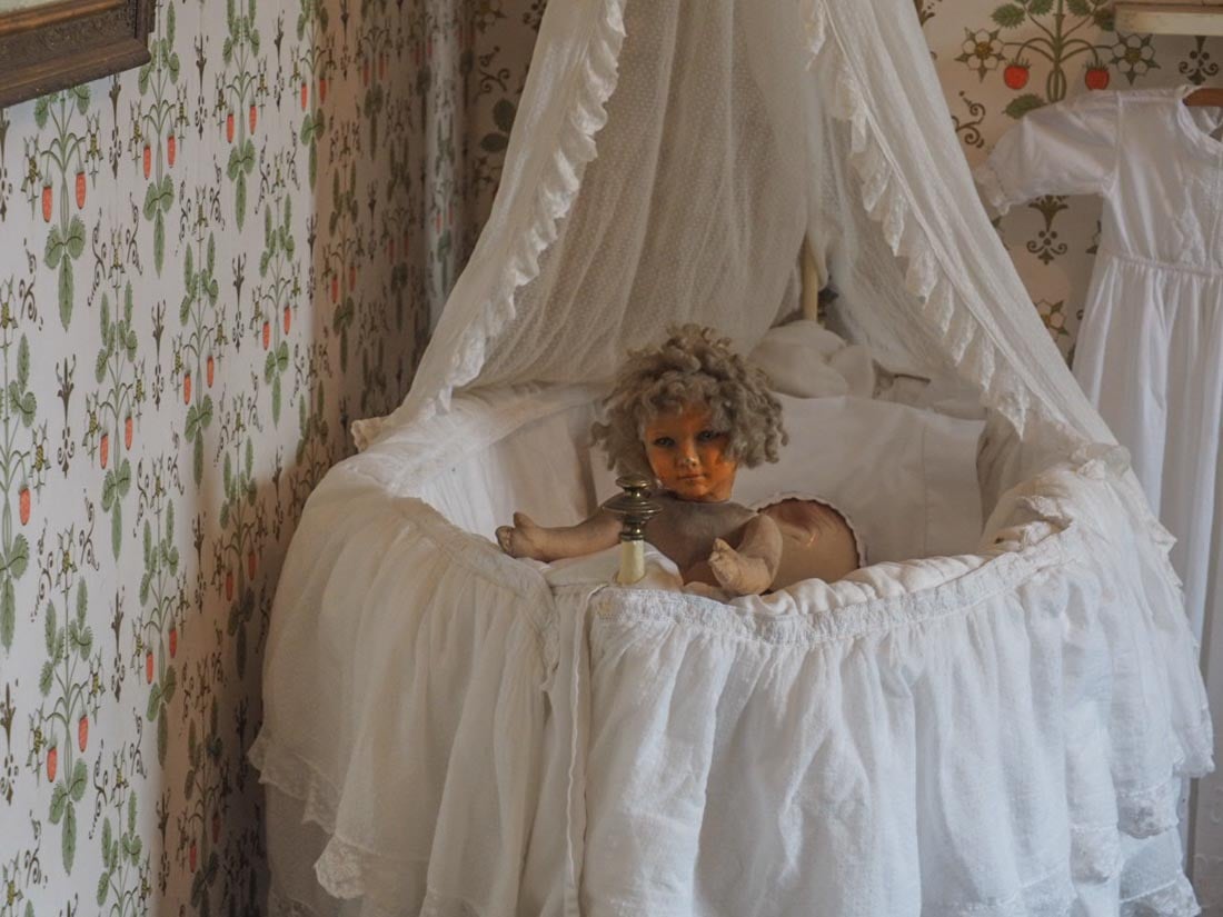 old doll and cot