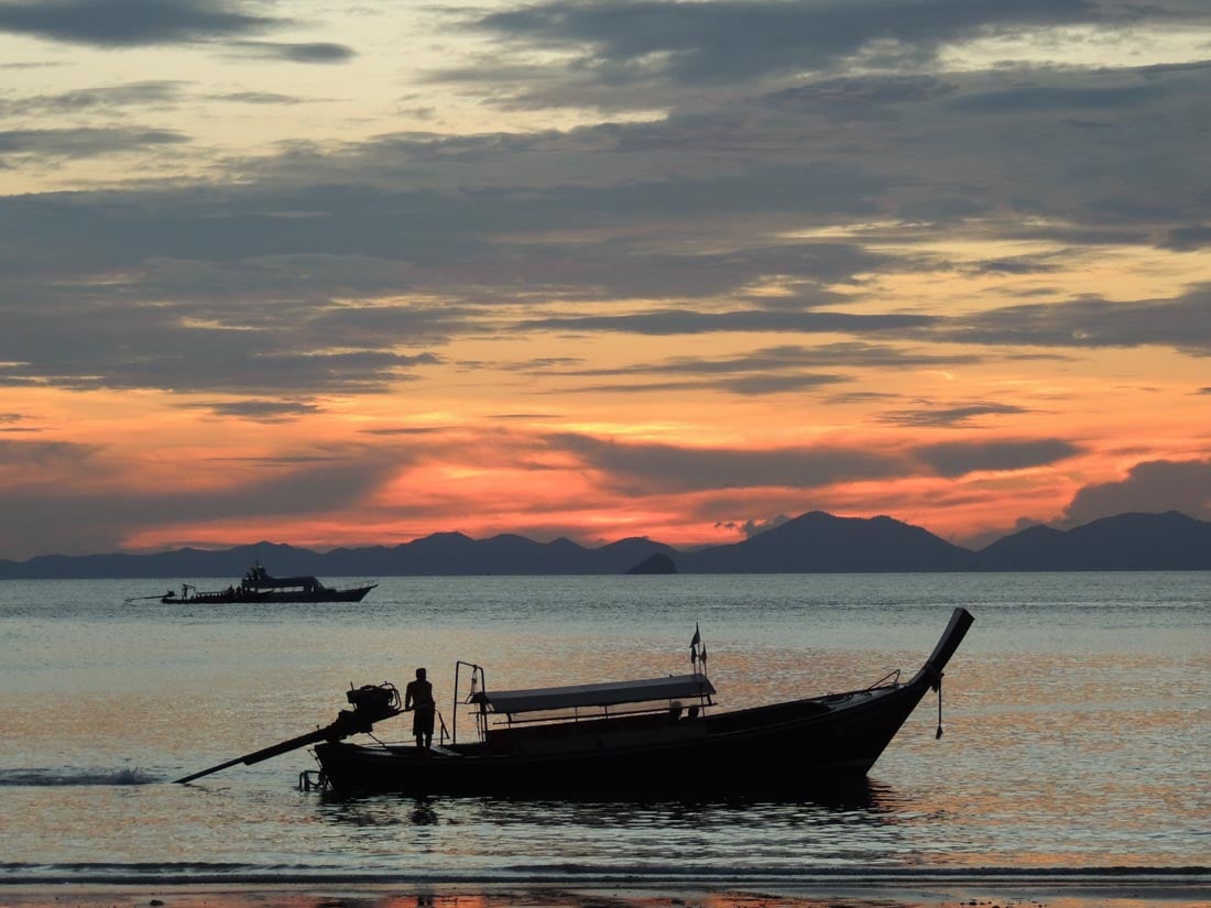 boat at sunset at railay beach